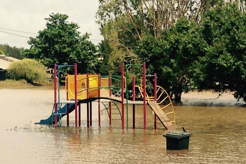 A playground re-emerges as floodwaters recede at Daly River community.