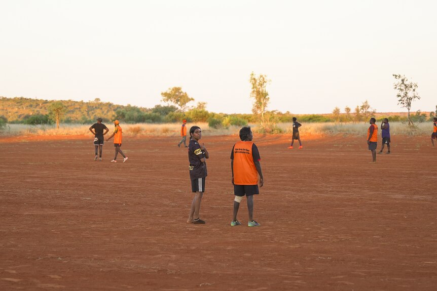 A photo showing a group of AFL players training.