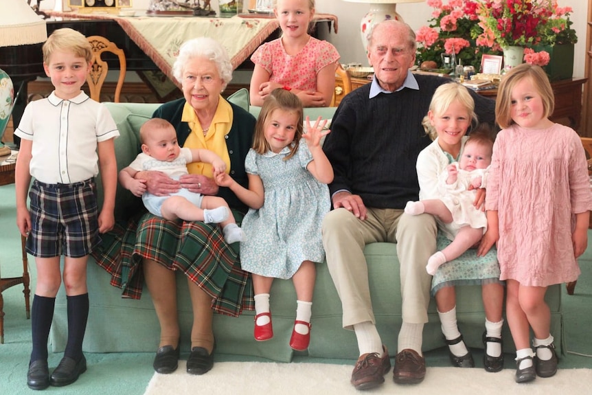 The Queen and the late Duke of Edinburgh, surrounded by seven of their great-grandchildren at Balmoral Castle in 2018. 