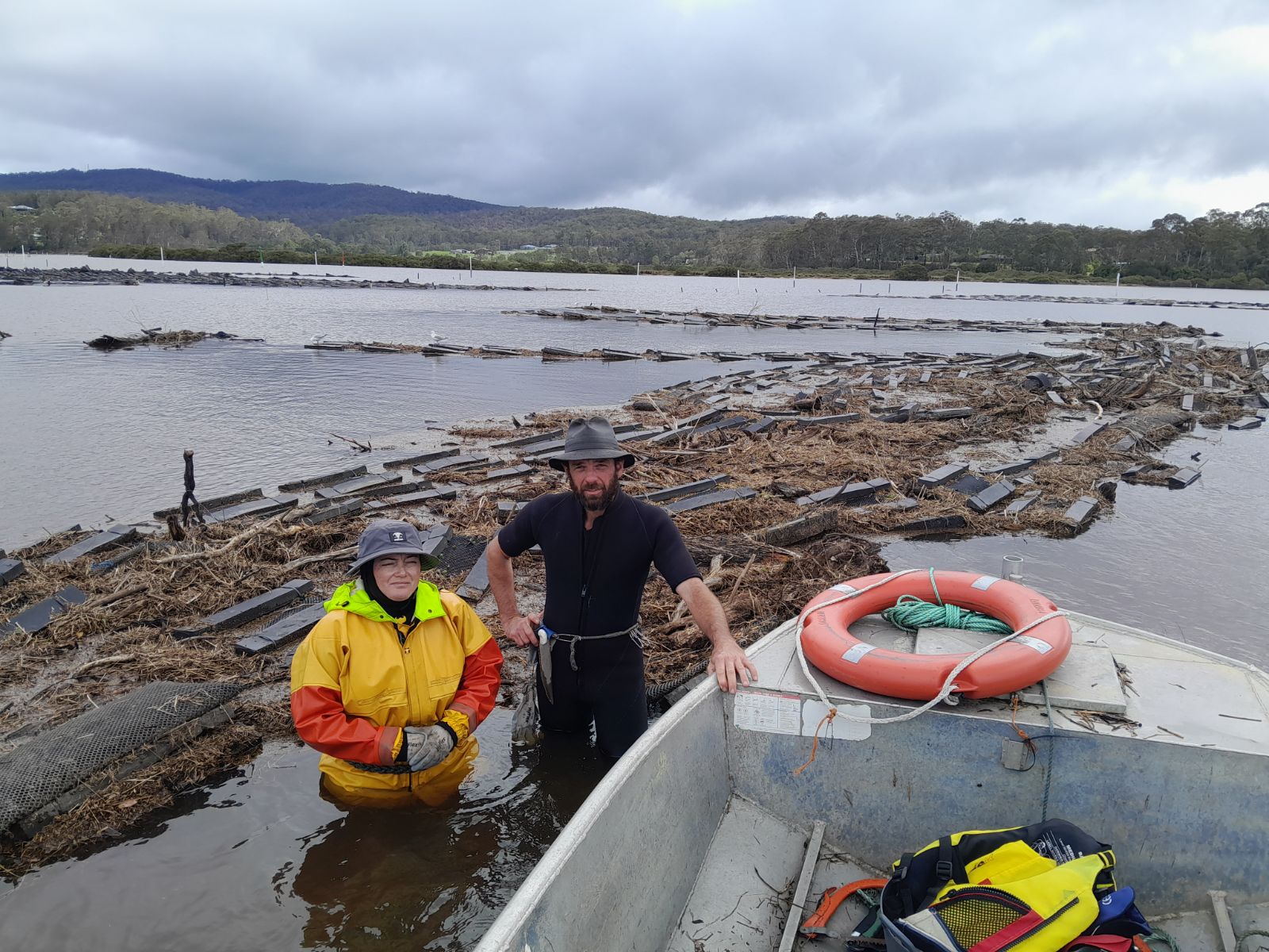 Oyster farmers Kelly Jones and Roy Glessing cleaning up their oyster lease
