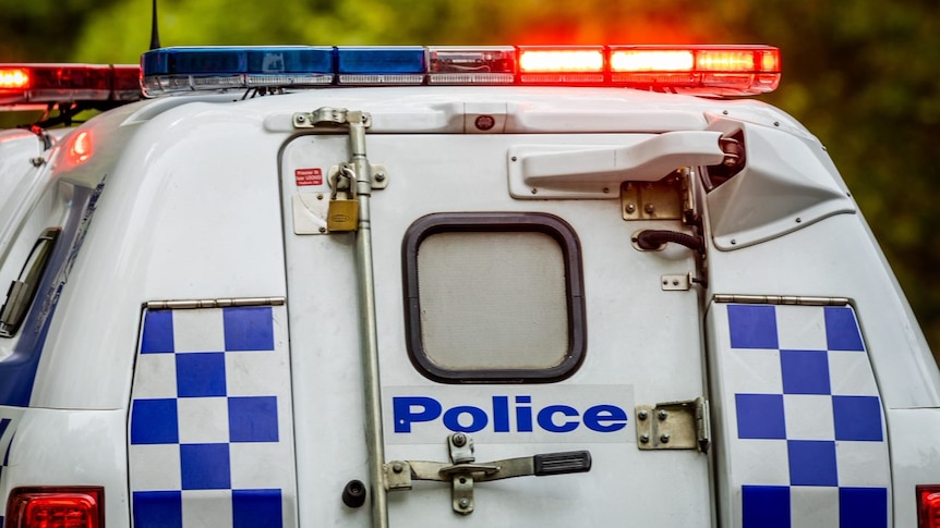 Victorian police car with lights on