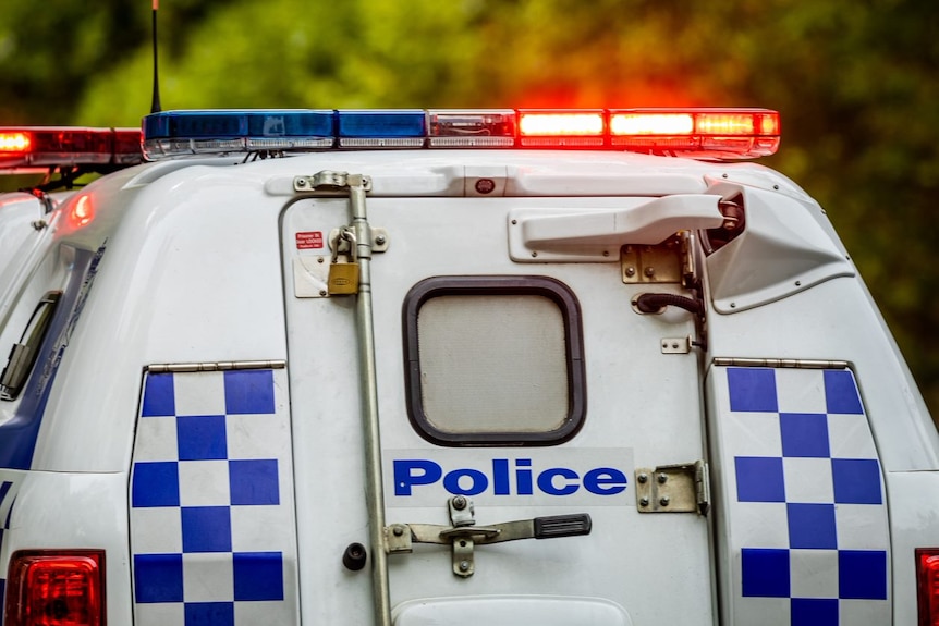 Victorian police car with lights on