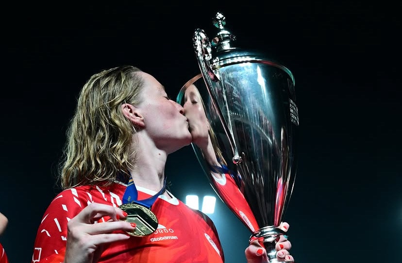 Abby Andrews kisses the champions league trophy