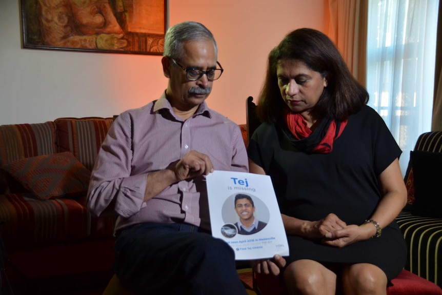 Reva and Jayant with a poster for their missing son Tej
