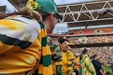 Matildas Active Support fans bang a drum in the stands during a game at Suncorp Stadium. 