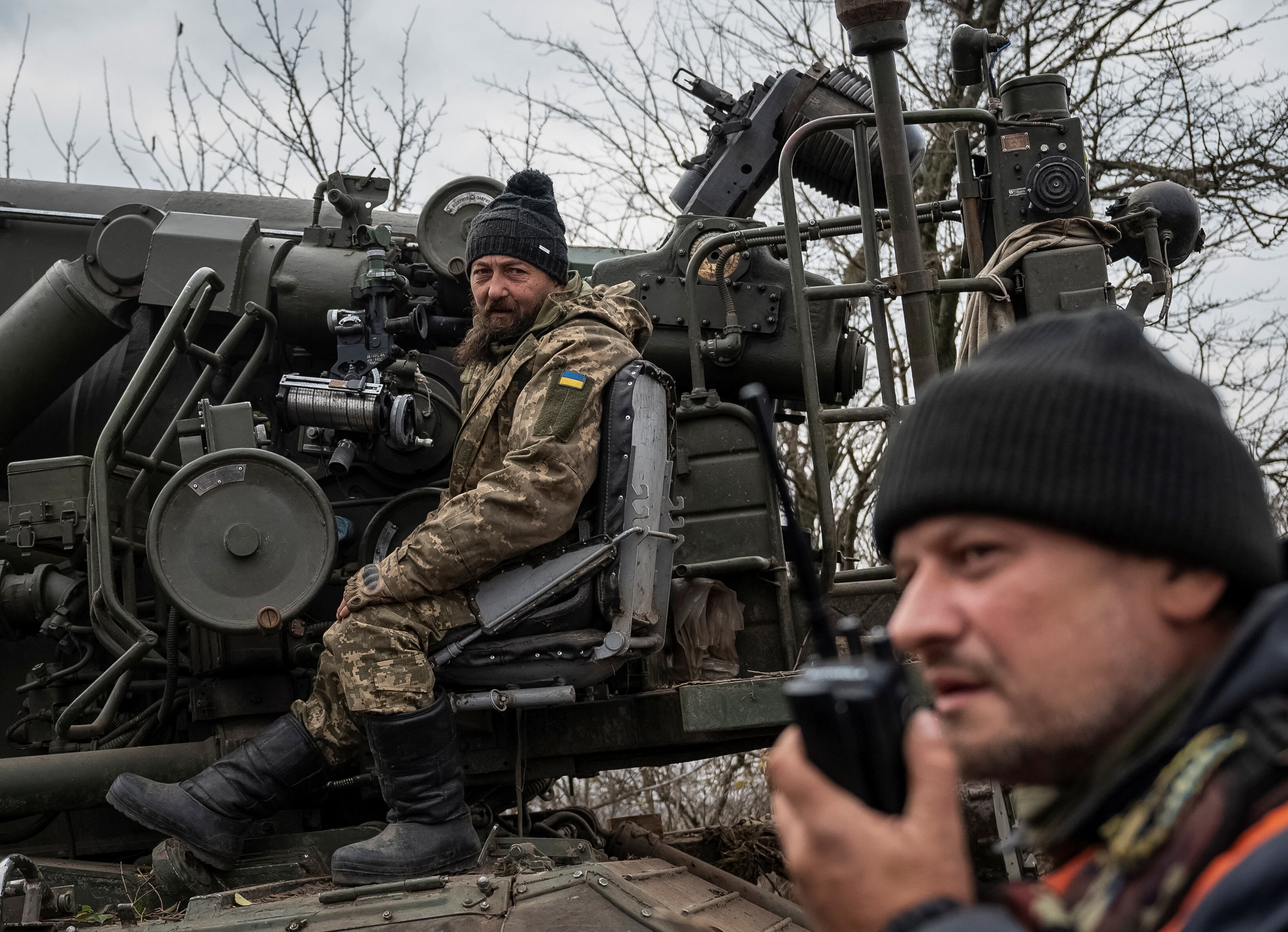 Ukrainian soldiers sitting inside a vehicle.