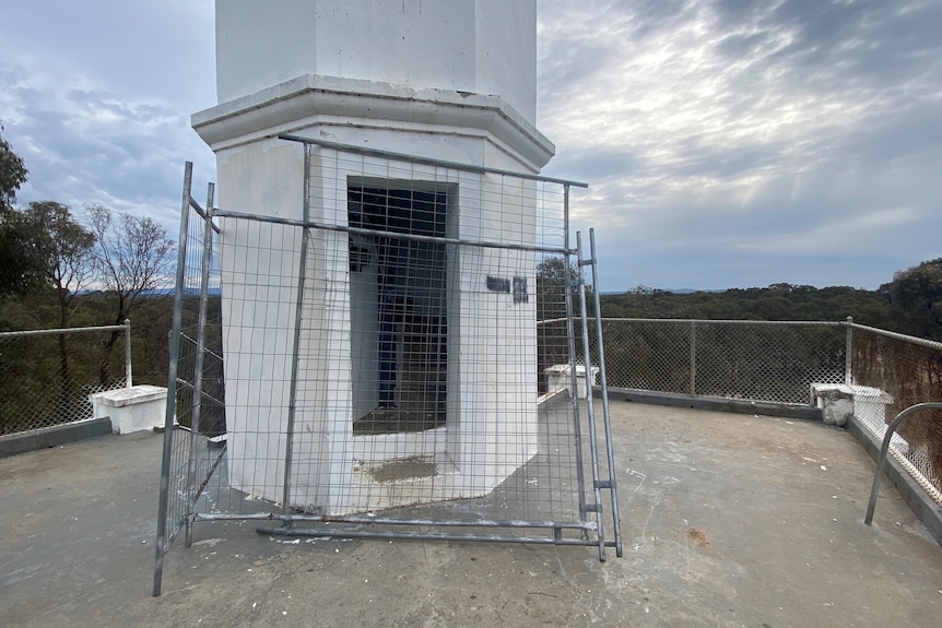 A picture of a steel barricade blocking access inside the tower, on the lookout platform