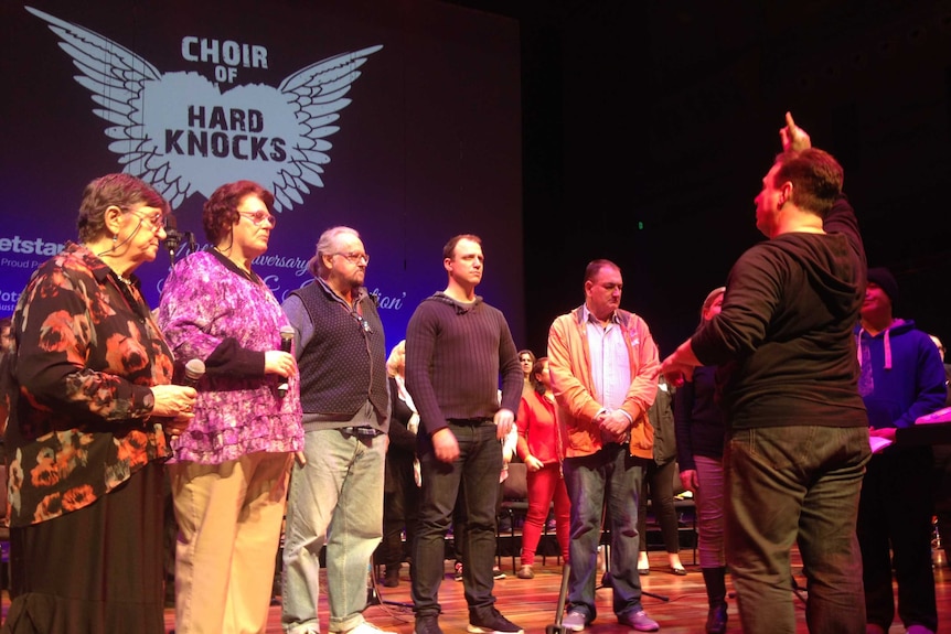 Choir of Hard Knocks artistic director Jonathon Welch leads a rehearsal