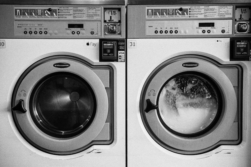 Two washing machines next to each other.