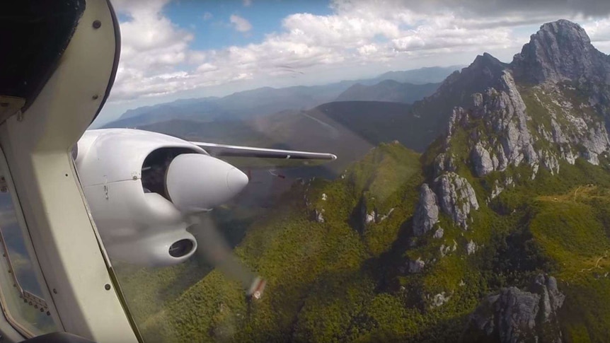 A Par Avion plane flies past Federation Peak, still from promotional video.