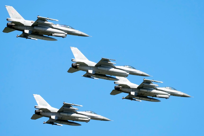 US-made F-16 fighter jets fly in the sky over Poland's capital.