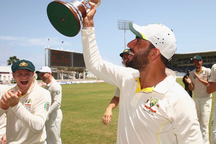 Fawad Ahmed celebrates with Frank Worrell Trophy