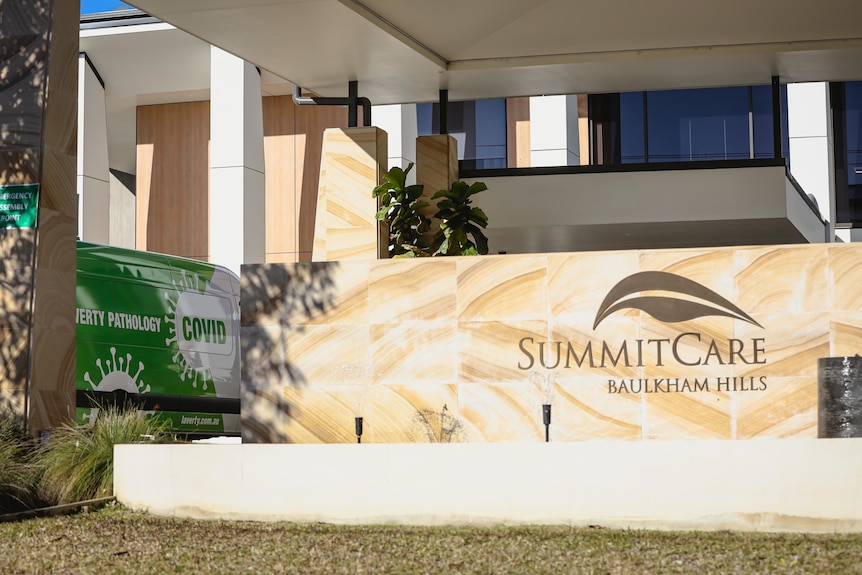 A pathology van parked outside the Summit Care aged care facility.