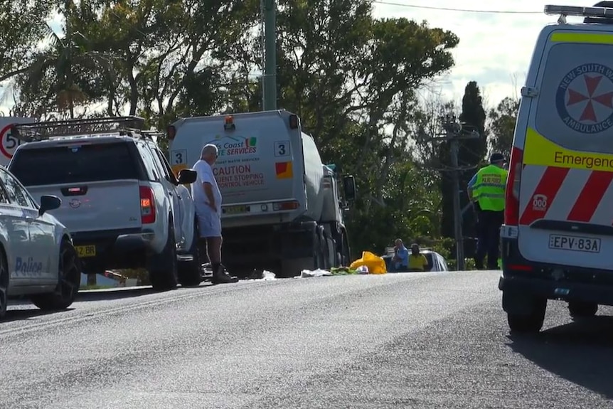 Accident scene surrounded by emergency services vehicles