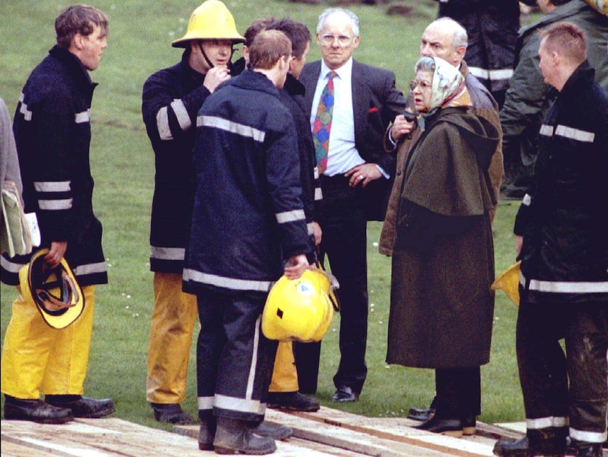 The Queen talks with firemen