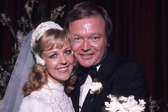 Patti McGrath and Bert Newton embrace for a photo on their wedding day.