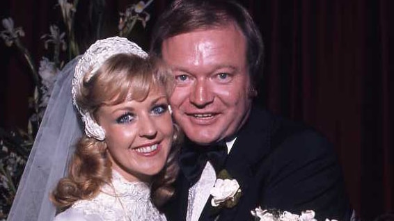 Patti McGrath and Bert Newton embrace for a photo on their wedding day.