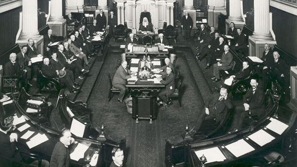 Senators sitting in old parliament house pose for a photo