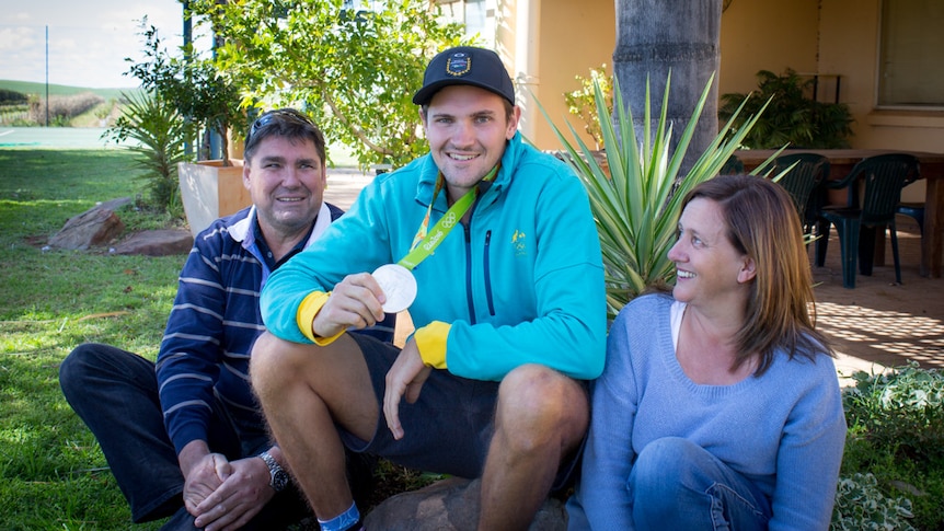 Alexander Hill with his silver Olympic medal at his Loxton North home with parents Peter and Michelle.