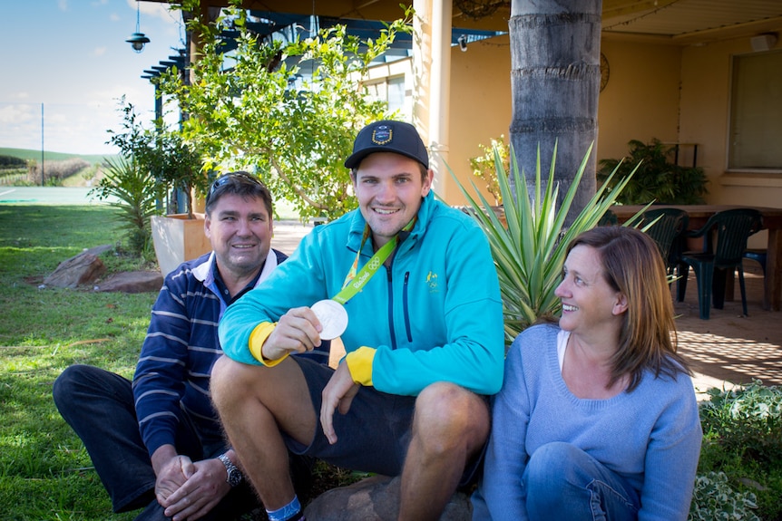 Alexander Hill with his silver Olympic medal at his Loxton North home with parents Peter and Michelle.