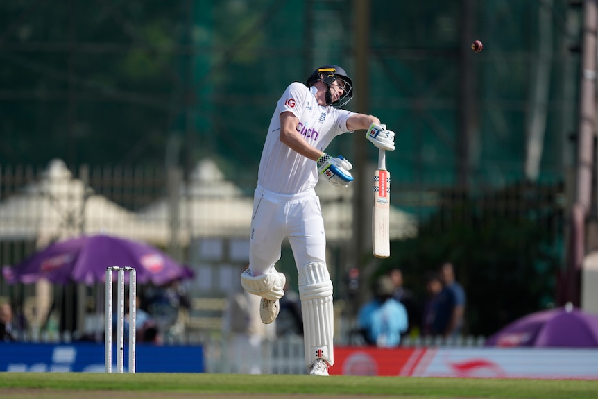 A cricket ball rebounds off England batter Zak Crawley on day one of the Test against India at Ranchi.