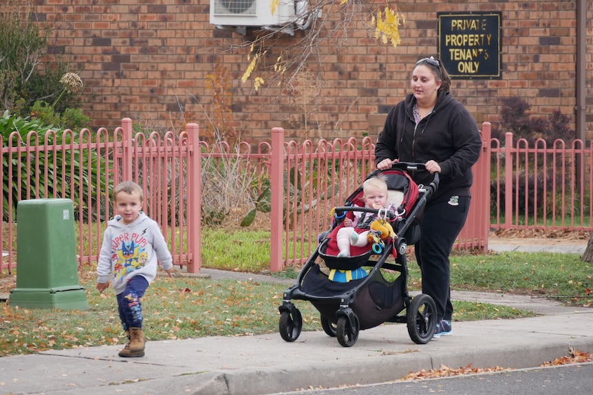 Hannah McPhee with her children walking along a footpath