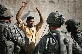 US soldiers question a man Baghdad in July 2007
