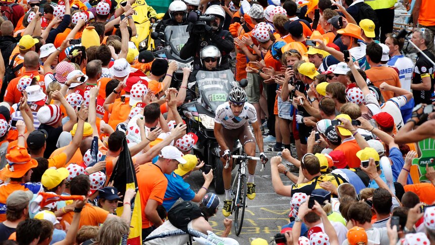 Christophe Riblon rides through the crowd during the Tour de France.