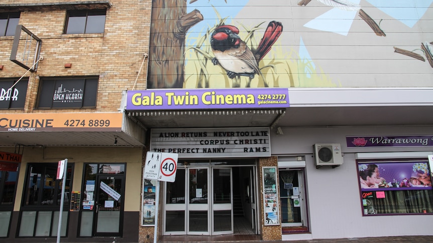 A cinema in rural Australia, squeezed between a pub and a massage parlour