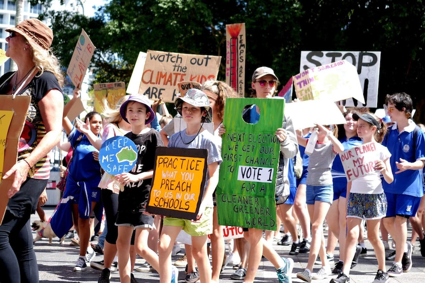 Climate change protesters marching in Cairns