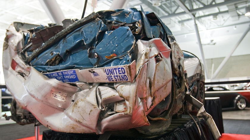 A crushed car sits ready to be recycled in Massachusetts, US, December 2008.