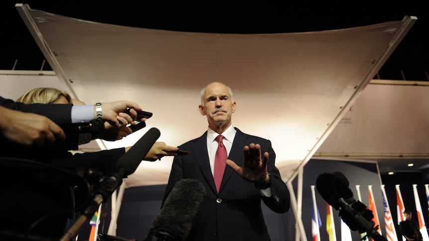 Hanging by a thread... Greek prime minister George Papandreou
