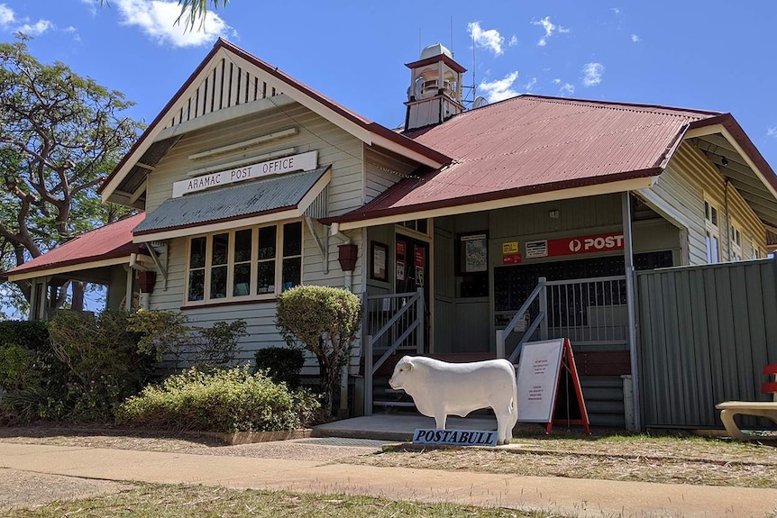 A white bull statute sits outside the Aramac Post Office in western Queensland