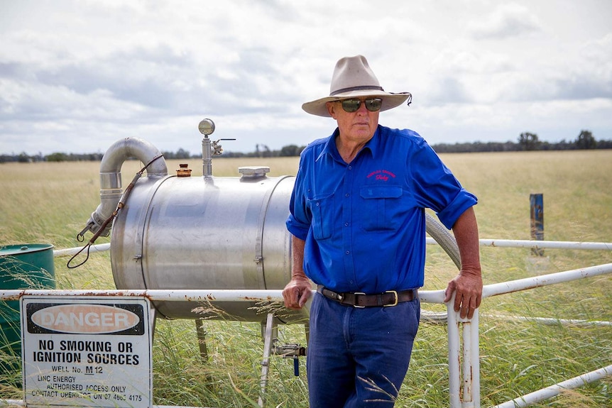 Toby Trebilco stands next to one of the Linc Energy monitoring bores located on his property.