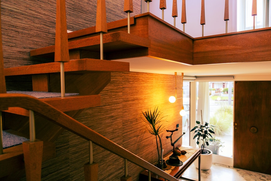A view of a timber staircase inside a home.