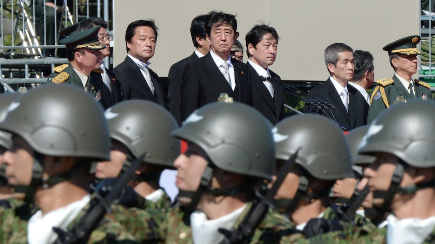 Japanese prime minister Shinzo Abe inspects Self-Defence Force troops