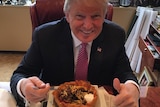 Donald Trump eats a taco bowl.
