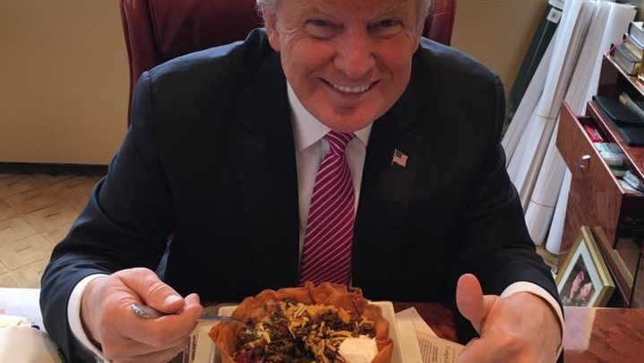 Donald Trump eats a taco bowl.