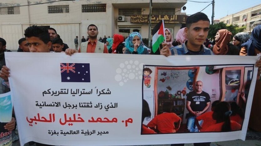 Friends and colleagues of World Vision employee Mohammad el Halabi rally in Gaza