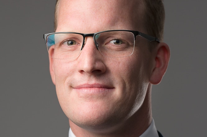 Headshot of man in business suit and tie