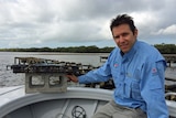 Dr Ben Diggles at the last oyster farm in Pumicestone Passage
