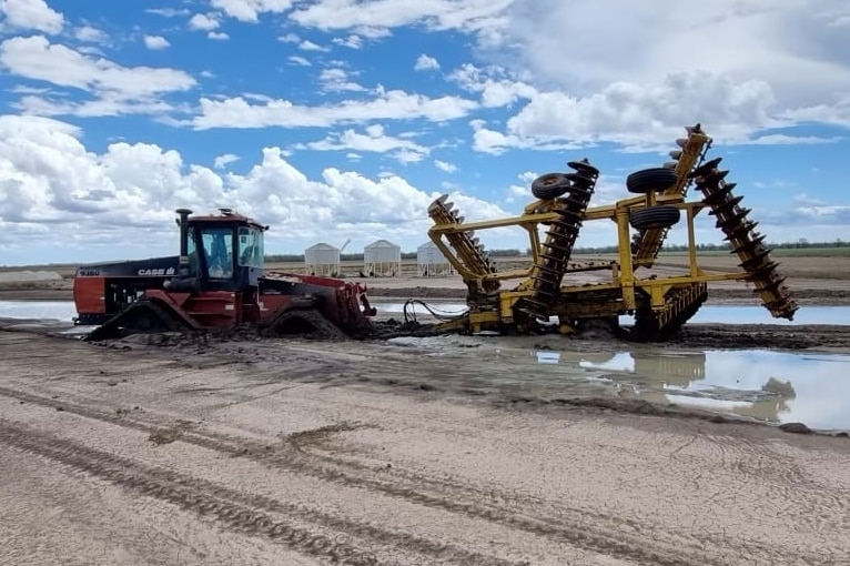 Harvesting equipment stuck in mud at Mr Egan's farm in Warren.