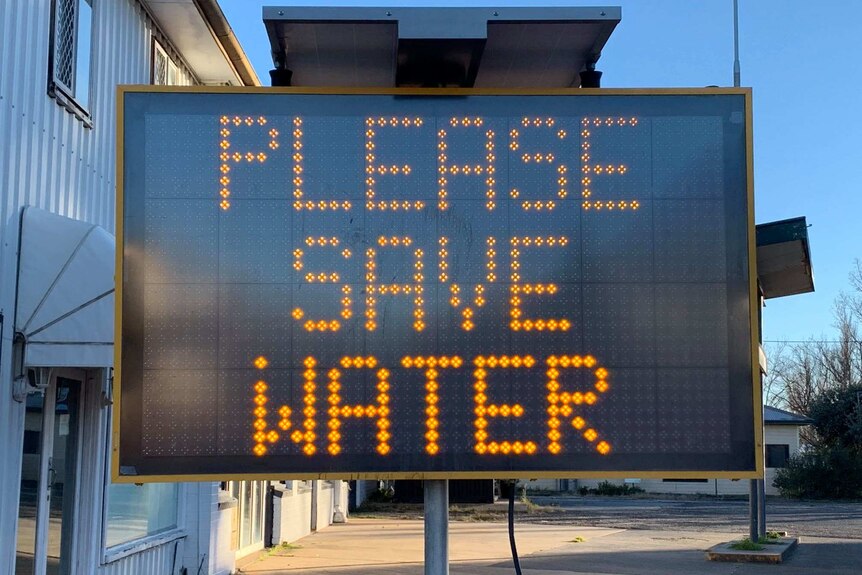 A sign urges residents of Guyra, NSW to save water.