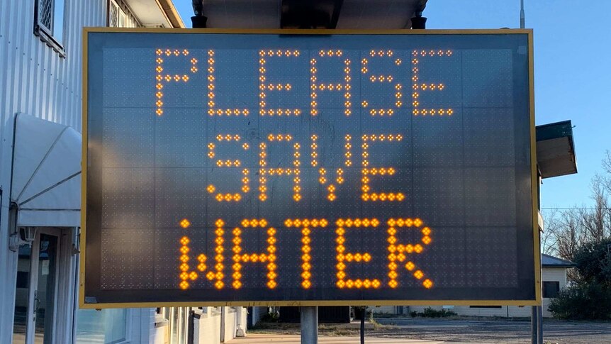 A sign urges residents of Guyra, NSW to save water.