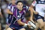 Billy Slater gets ready to pass the ball during a game.