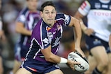 Billy Slater gets ready to pass the ball during a game.