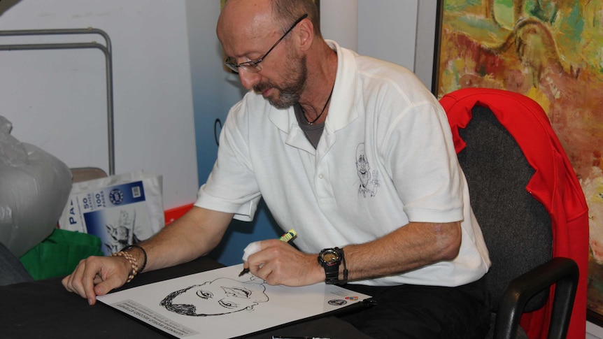 Cartoonist Chris Wilson reached 50 hours of drawing just after10 o'clock.