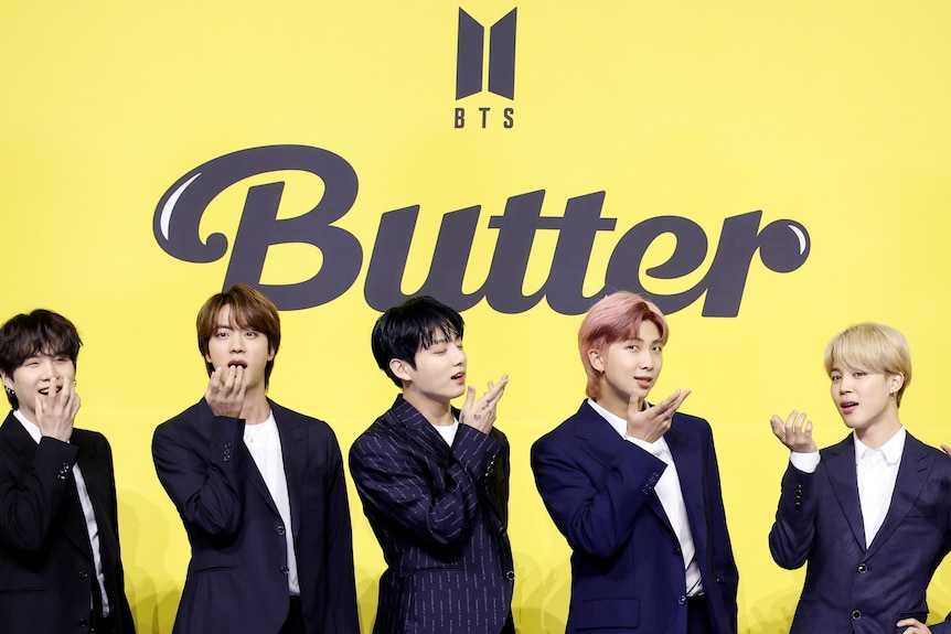 BTS members V, Suga, Jin, Jungkook, RM, Jimin and J-Hope promote the single Butter.