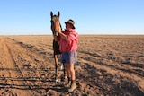 Cam Tindall, with horse 'Stromglad' at Darr River Downs