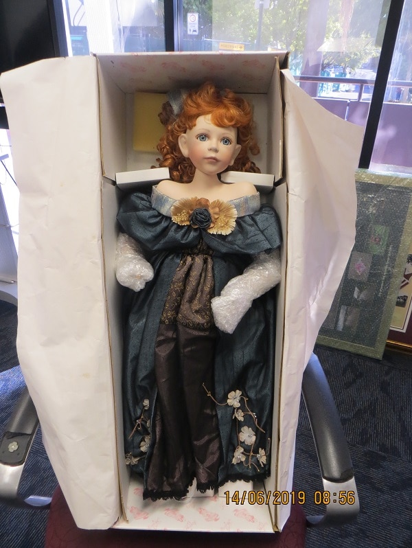 A porcelain doll in a box bought by the Ipswich City Council.